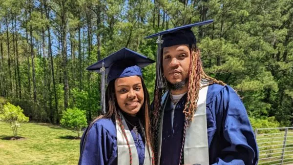 Military veteran graduates from college alongside his daughter