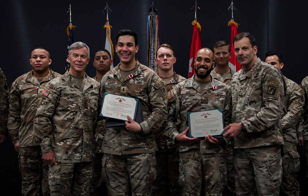 Innovation Champion 3rd Infantry Division Soldiers Named Winners of Dragon’s Lair 8 lined up for picture holding awards