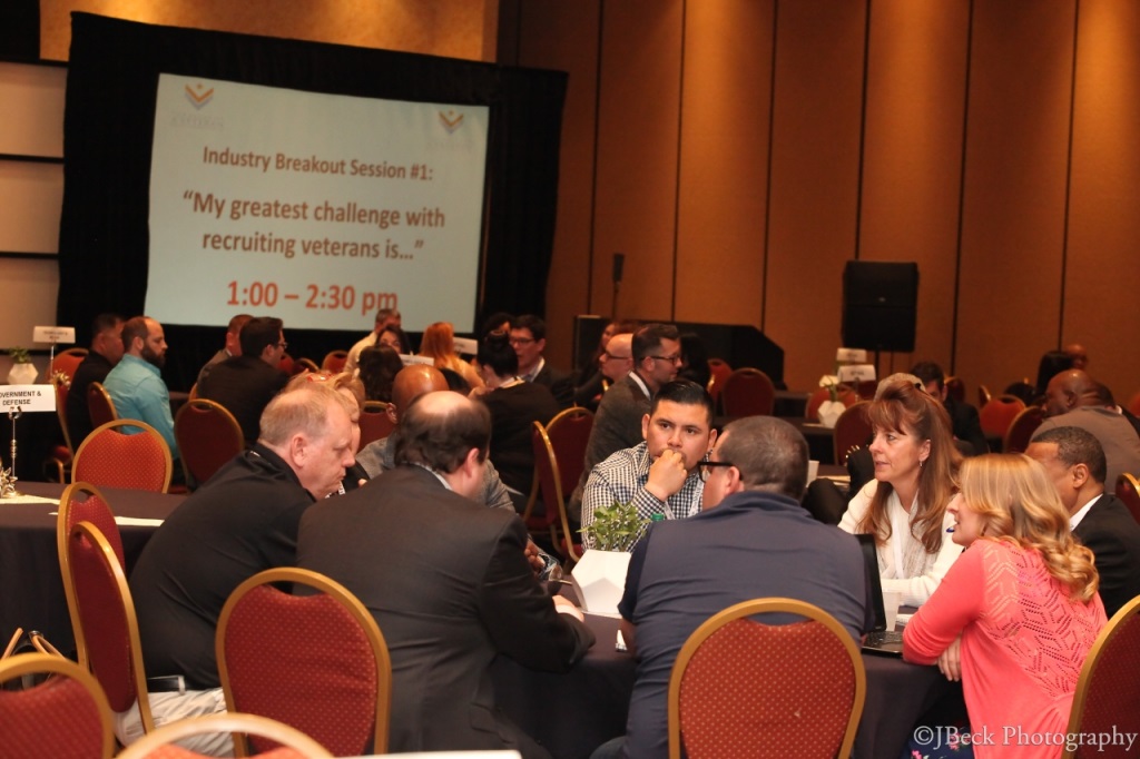 veteran recruiting conference in session with attendees seated at banquet tables