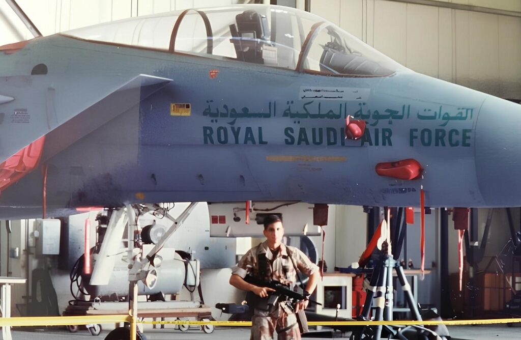 Jeff Pagano in uniform in front of Saudi fighter plane