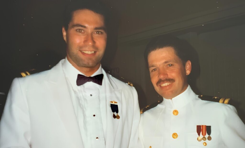 Robert and Ryan in white suits on way to a formal dinner