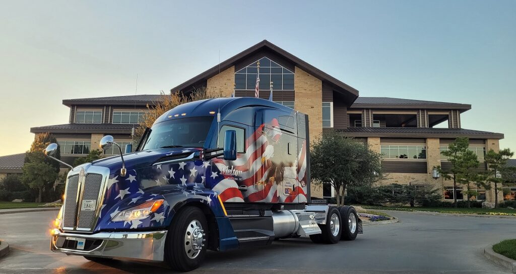 Colorful Melton Truck Line Truck pictured parked in front large home