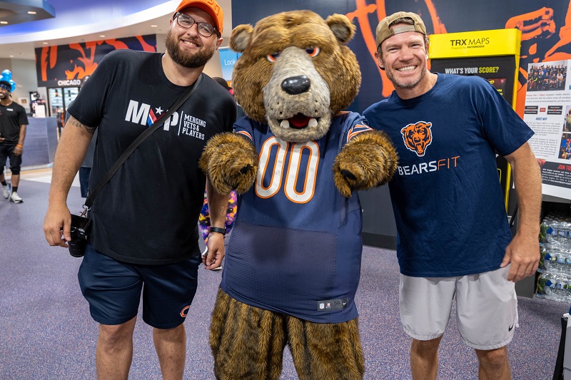 Nate Boyer attending an MVP Chicago Community Workout at Bears Fit with Program Manager Oscar Kush and Staley Da Bear, the Chicago Bears’ official mascot.